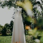 white dress on green grass field during daytime